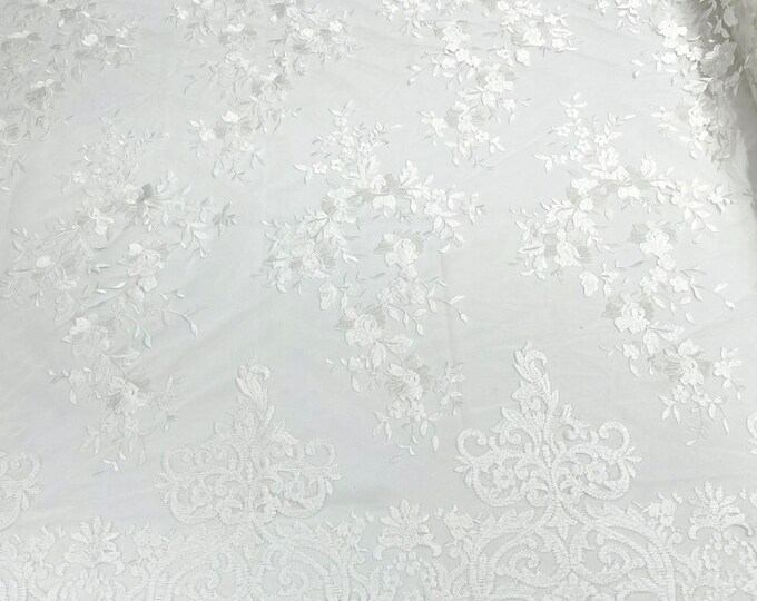 Ivory flowers flat lace embroider on a 2 way stretch mesh sold by the yard.