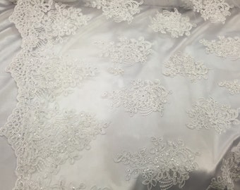 White flower lace corded and embroider with sequins on a mesh. Wedding/bridal/prom/nightgown fabric. Sold by the yard.