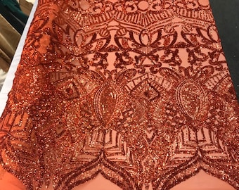 Burnt orange iridescent shiny sequin royalty design embroidery on a 4 way stretch mesh-prom-nightgown-sold by the yard-free shipping in USA.