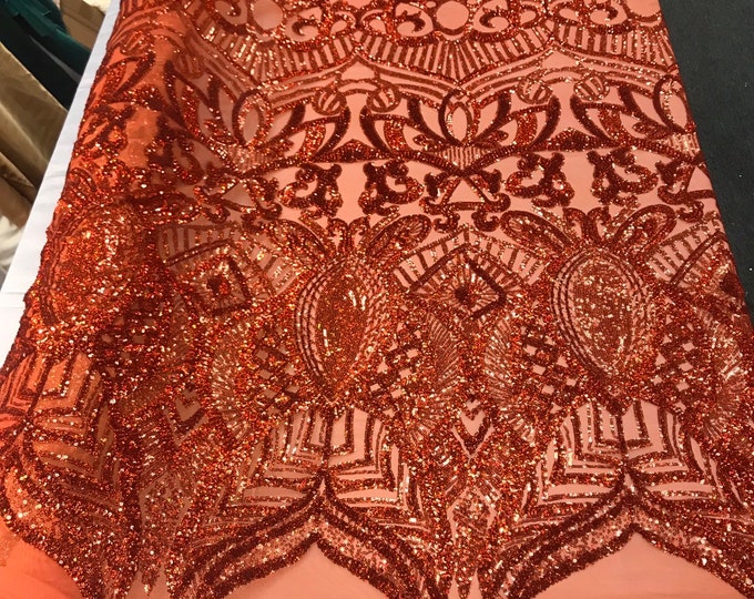 Burnt orange iridescent shiny sequin royalty design embroidery on a 4 way stretch mesh-prom-nightgown-sold by the yard-free shipping in USA.