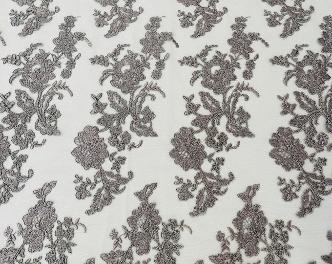 Gray floral design embroider and corded on a mesh lace fabric-sold by the yard.