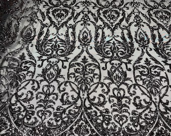 Black shiny sequin damask design on a black 4 way stretch mesh-prom- sold by the yard.