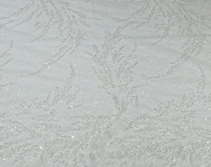 Clear/White elegant hand beaded design embroider on a glitter mesh lace-prom-sold by the yard.