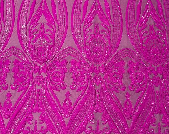 Magenta empire design embroider with glossy sequins on a 4 way stretch mesh--sold by the yard.NEW!