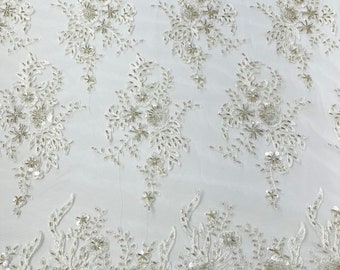 Gorgeous Ivory French design embroider and beaded on a mesh lace. Wedding/Bridal/Prom/Nightgown fabric.