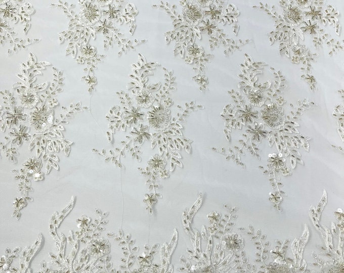 Gorgeous Ivory French design embroider and beaded on a mesh lace. Wedding/Bridal/Prom/Nightgown fabric.