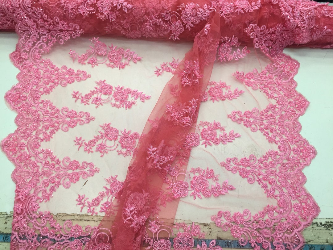 Elegant hand beaded design embroider on a glitter mesh lace-prom-sold by the yard. Clear/White