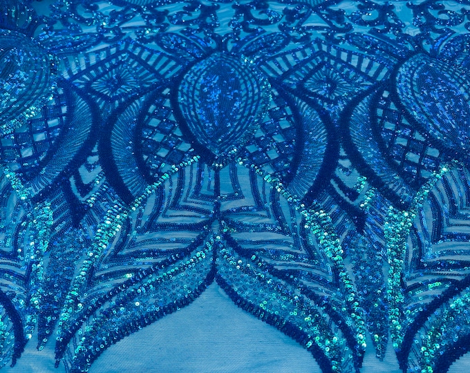 Turquoise iridescent royalty sequin design on blue 4 way stretch mesh-prom-sold by the yard.