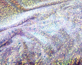 Aqua Clear iridescent mini round paillette sequins embroidered on a Lavender stretch mesh, sold by the yard.