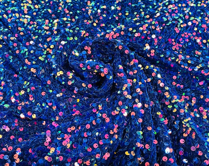 Rainbow iridescent 5mm sequins on a royal blue stretch velvet 2-way stretch, sold by the yard.