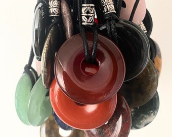 30mm donut Crystal  healing pendants with selection of gemstones on adjustable cord necklaces .