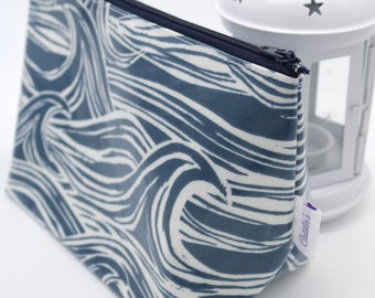 Stand alone oilcloth washbag in a dramatic navy wave print. Toiletry Bag. Make up bag. Vanity case.