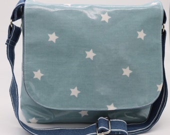 Blue star oilcloth messenger bag.