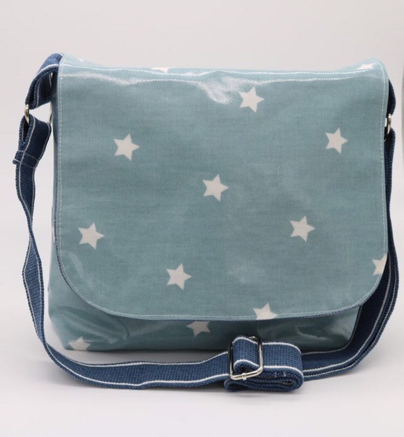 Blue star oilcloth messenger bag. image 1