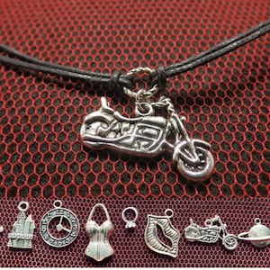 Rocky Horror Show unisex simple looped cord necklace with the charm of your choice.