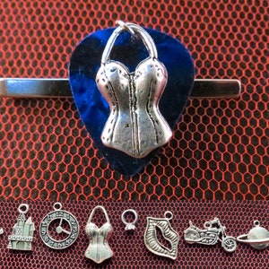 Rocky Horror Show guitar pick tie bar with the charm of your choice.