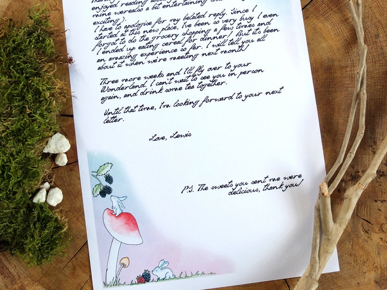 May include: A handwritten letter with a whimsical illustration of a rabbit on a mushroom. The letter mentions a visit to Wonderland and thanks the recipient for delicious sweets. The text reads: "enjoyed reading...  I have to apologize...  I ended up eating cereal...  Three more weeks...  Until that time, I'm looking forward to your next letter. Love, Lewis. P.S. The sweets you sent me were delicious, thank you!"