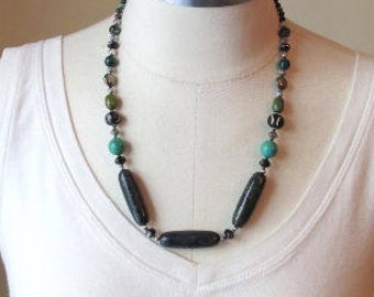 Striking and bold blue-green copper jasper beaded necklace with howlite, yak bone, czech glass, pyrite, and chrysocalla beads