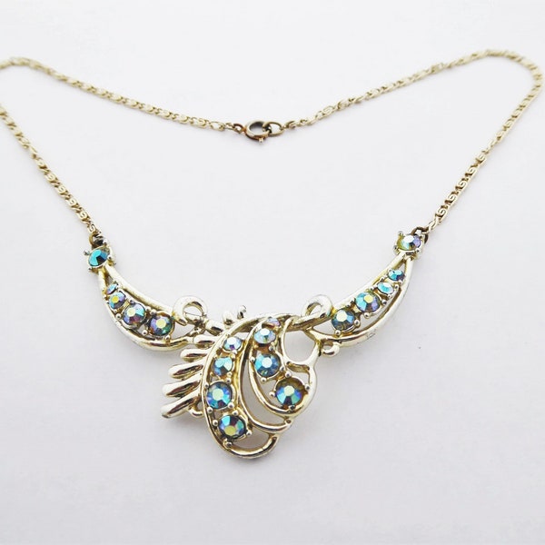 Vintage Pale Gold Tone Choker Length Necklace with Blue Aurora Borealis Rhinestone Swag and Swirl Panel