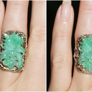 May include: A green jade ring with a carved floral design set in a gold band.