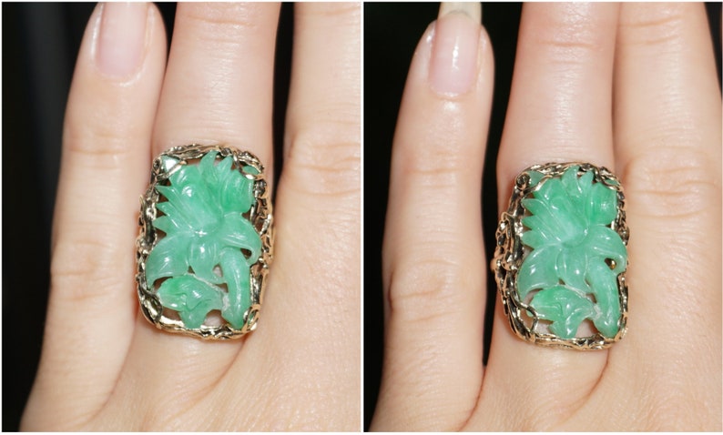 May include: A green jade ring with a carved floral design set in a gold band.