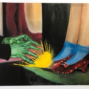 May include: An artistic painting depicts a scene from The Wizard of Oz. The image shows the Wicked Witch's green hand reaching towards Dorothy's ruby slippers. Dorothy's legs are visible, wearing blue socks and red sequined shoes.