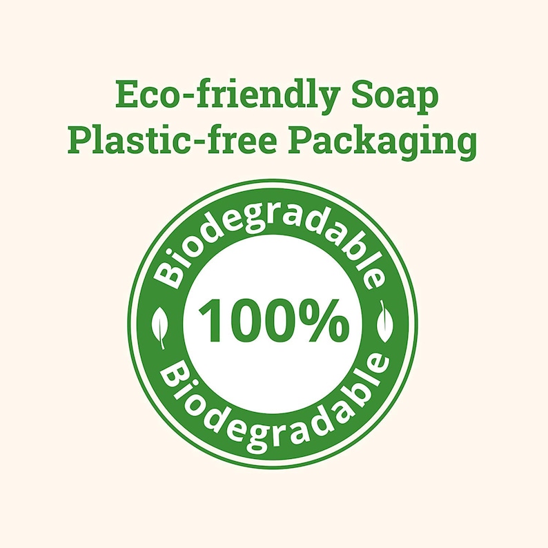 Puede incluir: C&iacute;rculo verde con texto blanco que dice "Biodegradable 100% Biodegradable" con un icono de hoja a cada lado del texto. El texto sobre el c&iacute;rculo dice "Jab&oacute;n ecol&oacute;gico Embalaje sin pl&aacute;stico."
