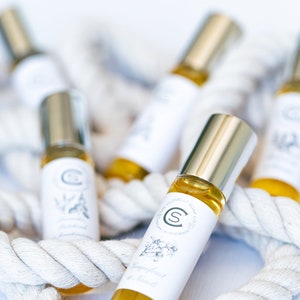 Patchouli Pulse Point Oil Perfume - Aromatherapy oil perfume in elegant glass and chrome bottle with earthy patchouli