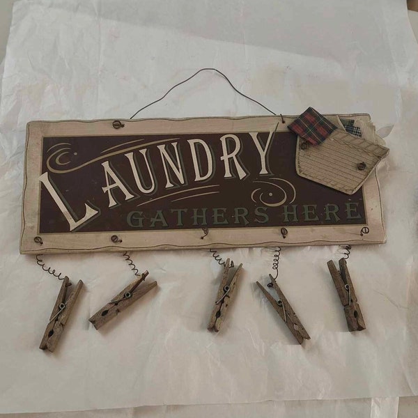 Cute "Laundry Gathers Here" Sign with Attached Clothes Pins Ready to Hang