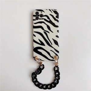 Zebra Black Hand Chain iPhone Case image 1