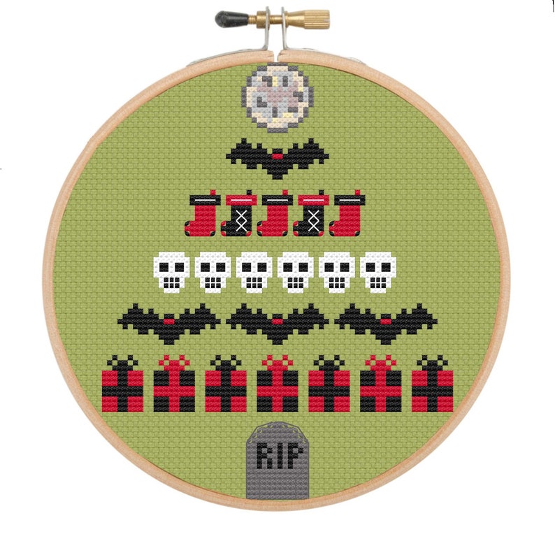 May include: Cross-stitch embroidery in a wooden hoop features a Halloween-themed Christmas tree design. The tree is composed of bats, skulls, stockings, and presents in red, black, and white against a green background. A tombstone with "RIP" is at the base.
