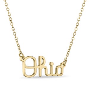 May include: Gold necklace with the word "Ohio" spelled out in a cursive font.