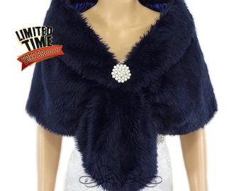 May include: Navy blue faux fur shawl with a pearl brooch. The shawl is soft and fluffy and would be perfect for a wedding or other special occasion.