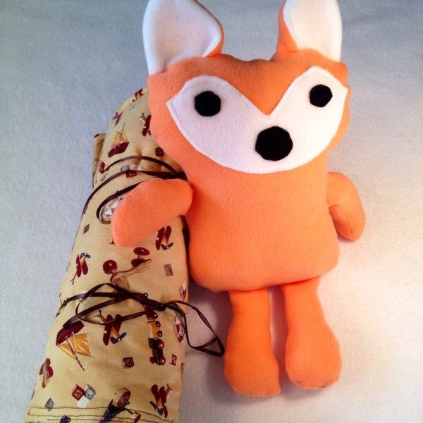 Cuddly woodland fox in sleeping bag