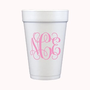 May include: White foam cup with a pink monogram of the letters "NCE" in a cursive font.