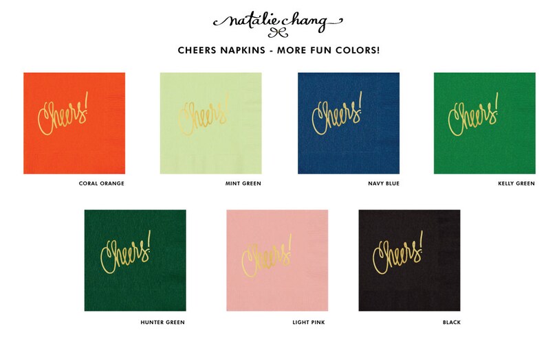 May include: A set of eight napkins with the word "Cheers!" printed in gold lettering on different colored backgrounds. The colors include coral orange, mint green, navy blue, kelly green, hunter green, light pink, and black.