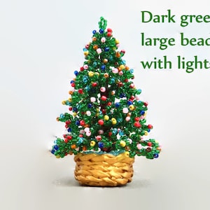 May include: A small Christmas tree made of dark green beads with colorful lights and a woven basket base.