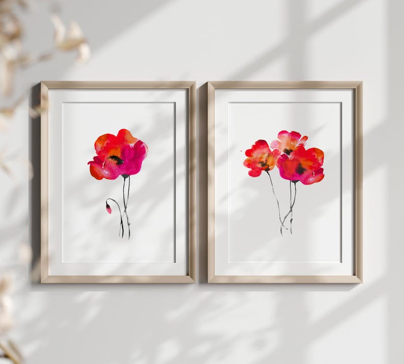 May include: Two framed watercolour paintings of red poppies. The painting on the left features a single poppy with a bud, while the painting on the right features three poppies.