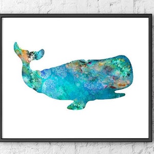 May include: A framed watercolor print of a whale. The whale is depicted in shades of blue, green, and orange, with a textured, watercolor effect. The artwork is set against a white background and framed in a black frame.