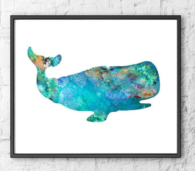 May include: A framed watercolor print of a whale. The whale is depicted in shades of blue, green, and orange, with a textured, watercolor effect. The artwork is set against a white background and framed in a black frame.