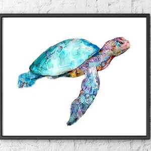 May include: Watercolor painting of a sea turtle in a black frame. The turtle has a turquoise shell and multi-colored body with shades of blue, purple, and orange. The artwork is displayed against a white background.
