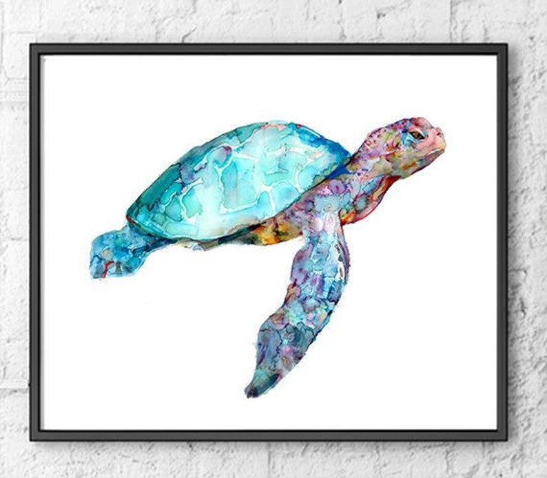 May include: Watercolor painting of a sea turtle in a black frame. The turtle has a turquoise shell and multi-colored body with shades of blue, purple, and orange. The artwork is displayed against a white background.
