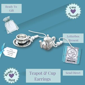 May include: Silver-toned teapot and cup earrings. The earrings feature a miniature teapot charm and a teacup with a saucer. The image also includes gift packaging and the text "Teapot & Cup Earrings."