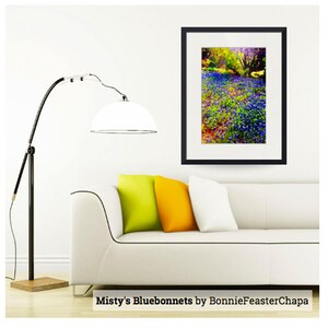 May include: A framed photograph of a field of bluebonnets in bloom. The flowers are a vibrant blue and purple, and the background is a soft green and yellow. The image is titled "Misty's Bluebonnets by BonnieFeasterChapa".