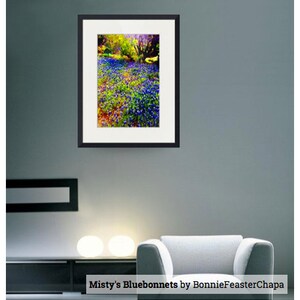 May include: A framed photograph of a field of bluebonnets in bloom. The flowers are a vibrant blue and purple, and the background is a soft green and yellow. The image is titled "Misty's Bluebonnets by BonnieFeasterChapa".