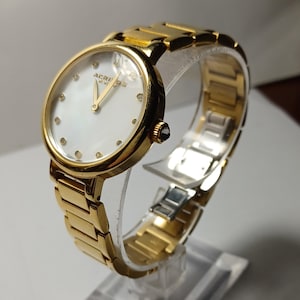 AKRIBOS XXIV Gold Tone Diamond Dial Ladies Quartz Wrist Watch- New Battery