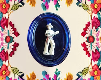 Vintage Cobalt Glass Oval with a Metal Mexican Musician Man Wall Ornament