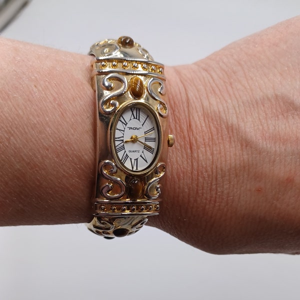 P.O.V. Gold Tone Ladies Clamper Fashion Watch with Tigers Eye