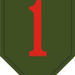 May include: A green military patch with a red number "1" in the center.