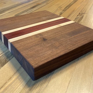 Custom handmade Bloodline cutting board made with Walnut, Maple and Bloodwood